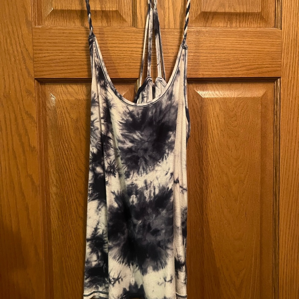 Black and white Tye dye tank top with criss cross straps. Size medium,